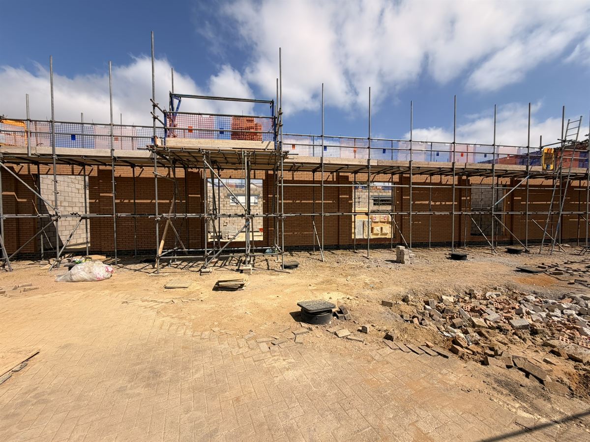 Education complex under construction, masonry and steel structure